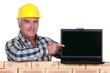 Photo: Manual worker with computer Manual worker with computer