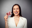 Photo: woman holding picture with dirty yellow teeth woman holding picture with dirty yellow teeth