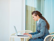 Photo: Business woman working laptop on terrace Business woman working laptop on terrace