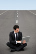 Photo: Businessman sat on road Businessman sat on road
