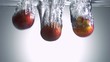 Fresh pear dropped into water with bubbles