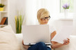 Beautiful woman working at home .