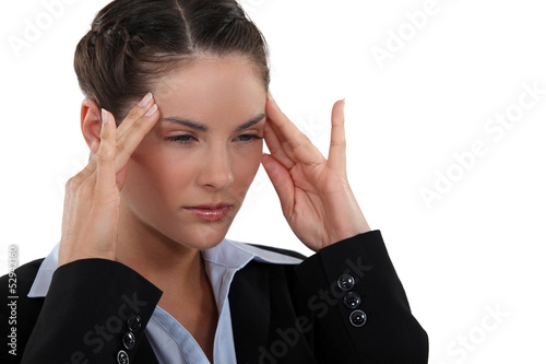 Photo: Brunette with a headache. Brunette with a headache.
