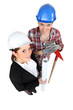 Foto: high angle shot of female architect and female bricklayer high angle shot of female architect and female bricklayer