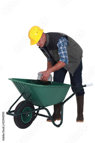 Photo: Builder with a wheelbarrow Builder with a wheelbarrow