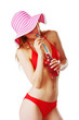 blonde girl in beachwear drinking lemonade and having fun
