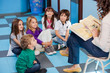 Teacher Reading Story Book To Children