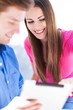 Young Couple Using Digital Tab...