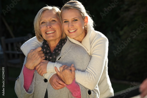 Photo: Grandmother and granddaughter hugging Grandmother and granddaughter hugging