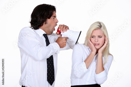 Photo: businessman shouting through a megaphone businessman shouting through a megaphone