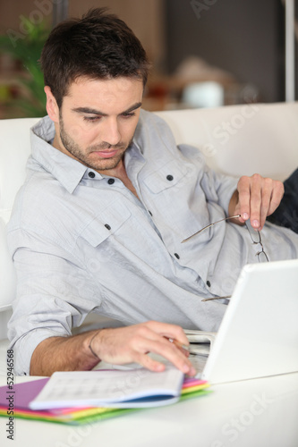 Photo: Man working using PC Man working using PC
