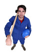 Photo: Man posing with sledge-hammer over shoulder Man posing with sledge-hammer over shoulder