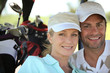 Photo: Couple playing golf Couple playing golf
