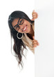 Indian businesswoman peeking from behind blank sign billboard