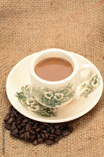 Photo: A Cup Of Coffee With Coffee Seeds A Cup Of Coffee With Coffee Seeds
