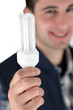 Photo: Electrician with a light bulb Electrician with a light bulb