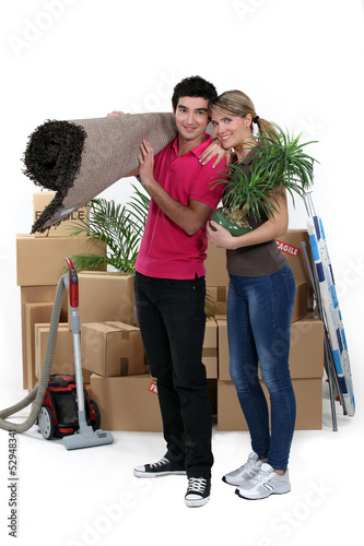 Photo: couple arranging their new apartment couple arranging their new apartment