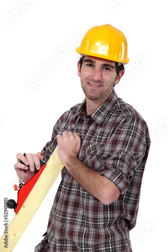 Photo: Man with wood plane Man with wood plane