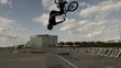 BMXer Extreme Backflip Against Blue Sky