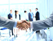 Photo: Close up of businessmen shaking hands Close up of businessmen shaking hands