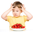 Little boy refuses to eat strawberries