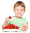 Photo: Happy little boy with strawberries Happy little boy with strawberries