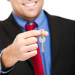 Photo: Businessman holding a key Businessman holding a key