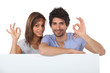 Photo: Couple giving the OK gesture Couple giving the OK gesture