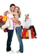 Three people with shopping bags