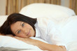 Photo: Woman lying in bed Woman lying in bed