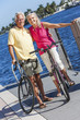 Foto: Happy Senior Couple on Bicycles By a River or Sea Happy Senior Couple on Bicycles By a River or Sea