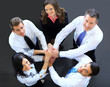 Photo: Top view of business people with their hands together Top view of business people with their hands together