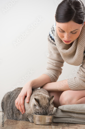 Photo: Beautiful young woman and her cat Beautiful young woman and her cat