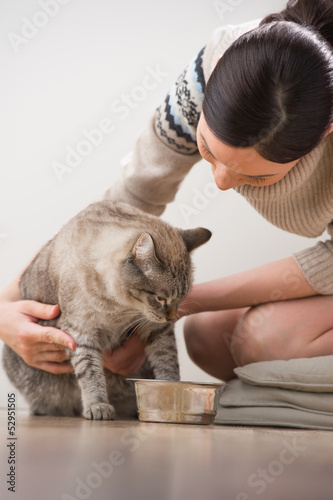 Photo: Beautiful young woman and her cat Beautiful young woman and her cat