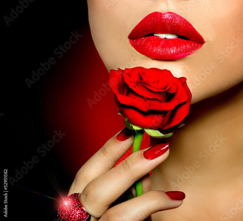 Photo: Beautiful Red Lips, Nails and Rose Flower. Beauty Girl Beautiful Red Lips, Nails and Rose Flower. Beauty Girl