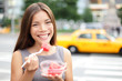 Photo: Business woman in New York eating watermelon snack Business woman in New York eating watermelon snack