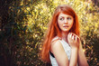 portrait of the rural red-haired girl