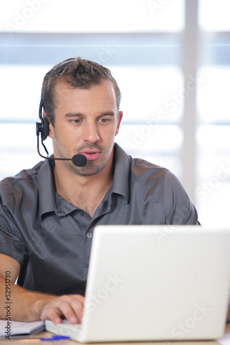 Photo: Man working in an office Man working in an office