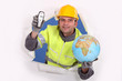 Foto: happy-looking builder holding globe and cordless phone happy-looking builder holding globe and cordless phone
