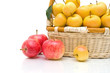 wicker basket with apples on a white background