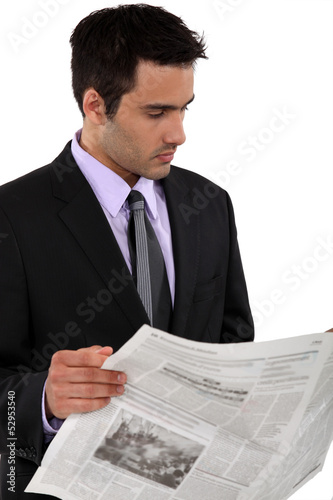 Photo: Businessman reading a newspaper Businessman reading a newspaper