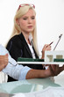 Photo: woman and a man looking a house scale model woman and a man looking a house scale model