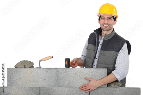 Photo: Man building wall Man building wall