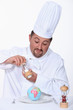 Chef putting salt on his meal