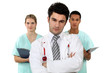 Photo: young doctor standing cross-armed with colleagues nurses young doctor standing cross-armed with colleagues nurses