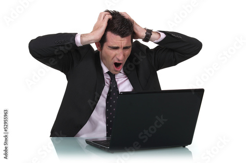 Photo: Man shouting at laptop Man shouting at laptop