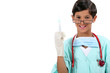 Boy dressed as doctor holding needle