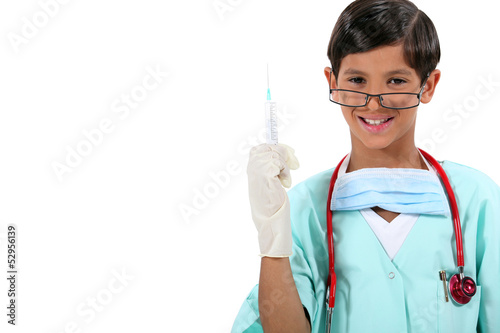 Photo: Boy dressed as doctor holding needle Boy dressed as doctor holding needle