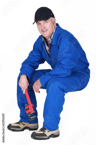Photo: Middle-aged plumber sat down Middle-aged plumber sat down