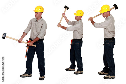 Photo: Men holding sledge-hammers Men holding sledge-hammers